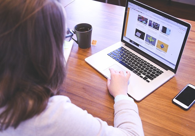 woman researching on her laptop