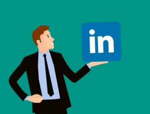 man holding LinkedIn logo